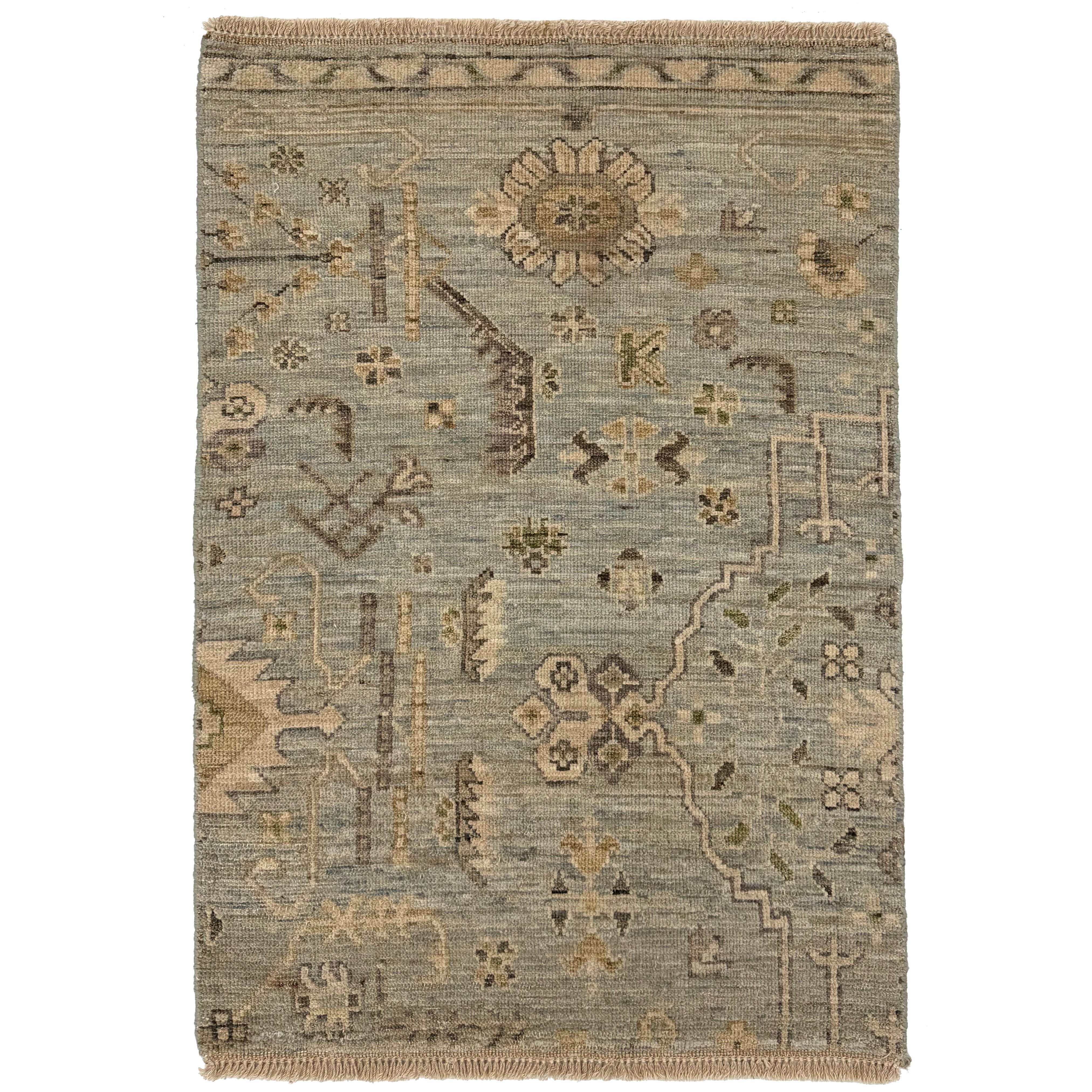 Handknotted rug with old world damask design in blue, cream and grey. 