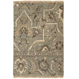 Handknotted rug in ornate damask pattern in blue, grey and cream.