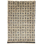 Patterned rug with geometric design on a white background