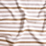 Close up of gently draped striped woven Indoor-Outdoor fabric in white and neutral tones.