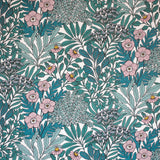 Detail of wallpaper in a dense floral print in turquoise, pink and yellow on a white field.