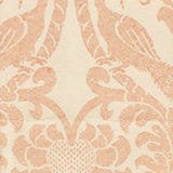 Detail of wallpaper in a botanical and bird print in pink on a cream field.