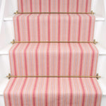 Striped flatweave runner in pink on white staircase