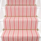 Striped flatweave runner in pink on white staircase