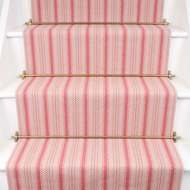 Striped flatweave runner in pink on white staircase