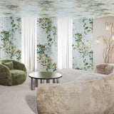 Modern living room with a textured beige sofa, green armchair, and round table.