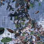 Floral pattern on a tiled design in blue, green, and brown.