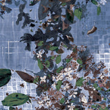 Floral pattern on a tiled design in blue, green, and brown.