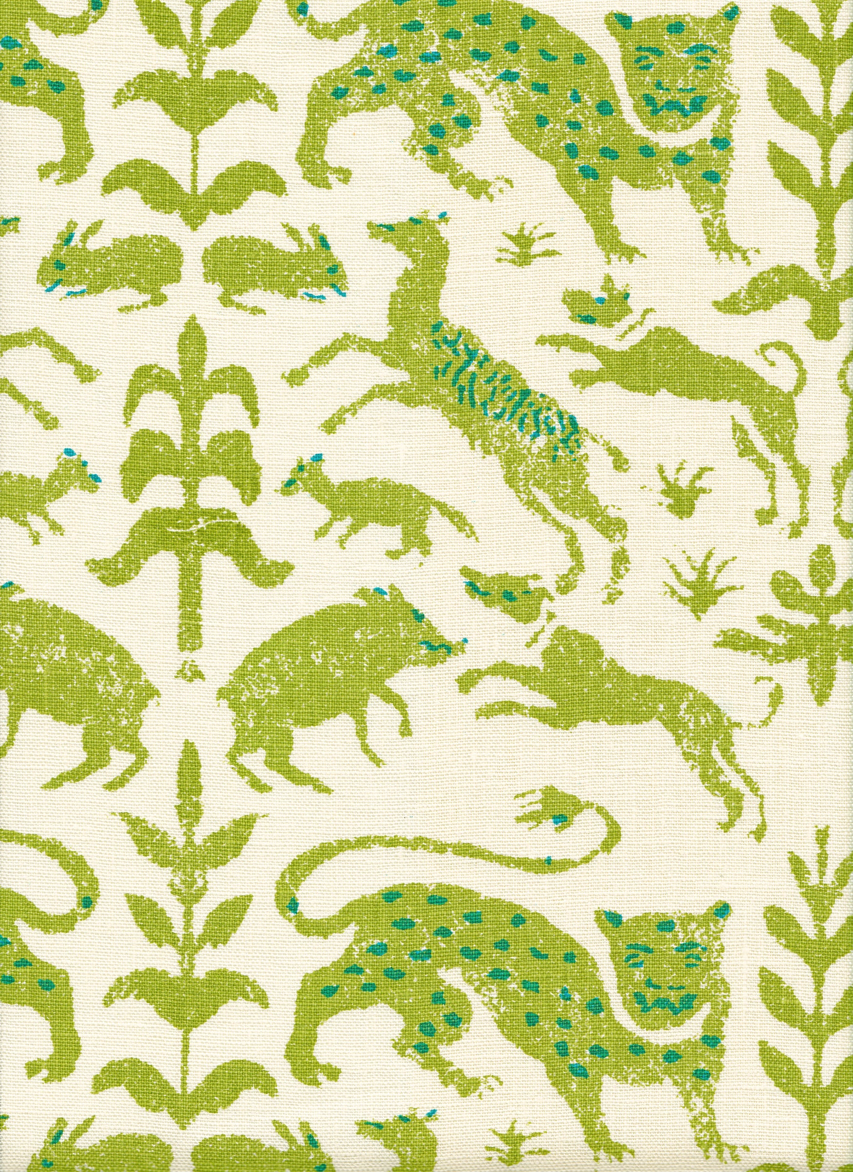 Detail of fabric in a playful animal and botanical print in green and blue on a cream field.