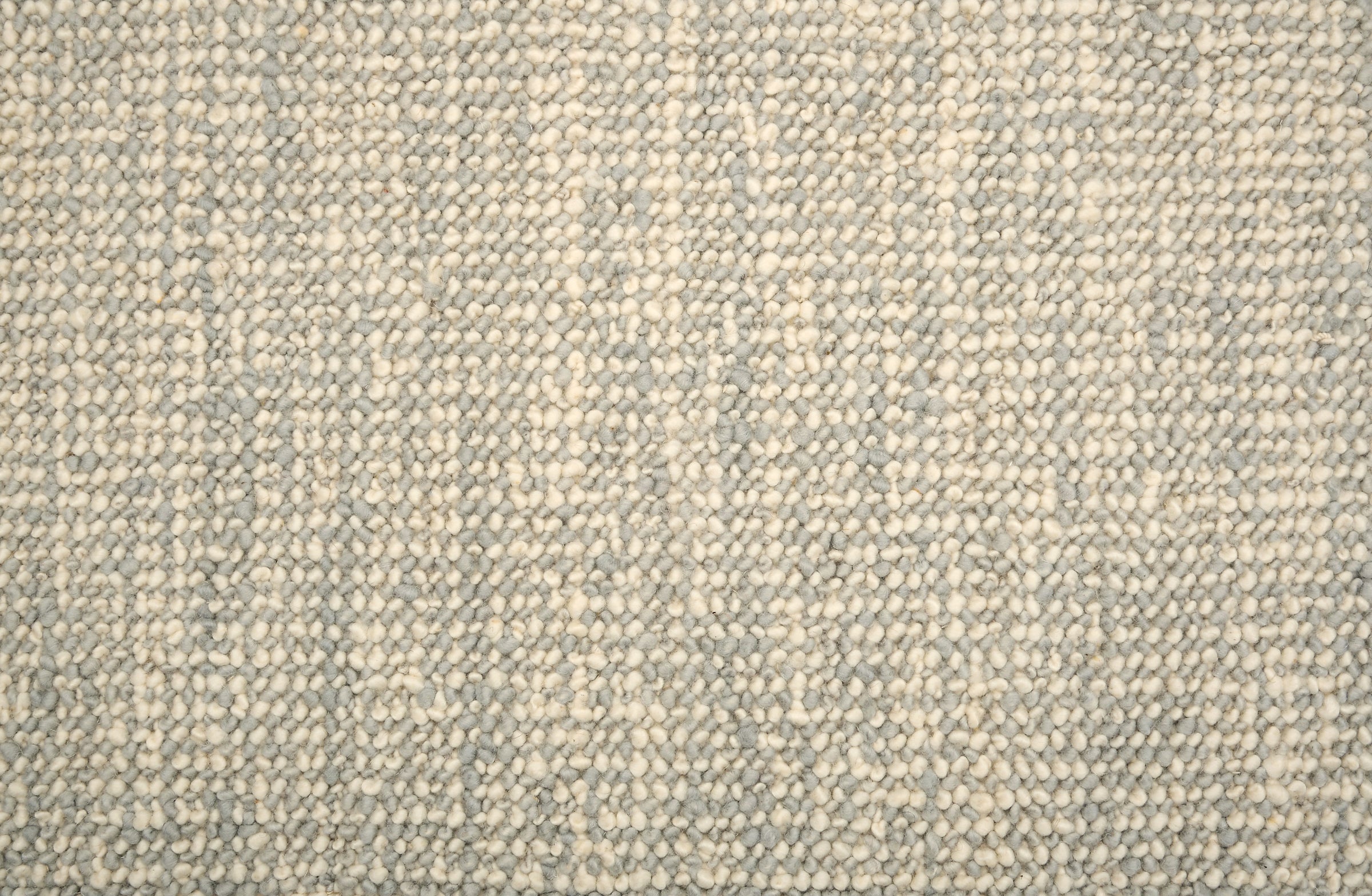 Textured loop carpet in cream and sky blue.