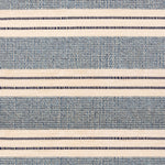 Broadloom carpet in a wide stripe in blue and cream with navy accent stripes. 
