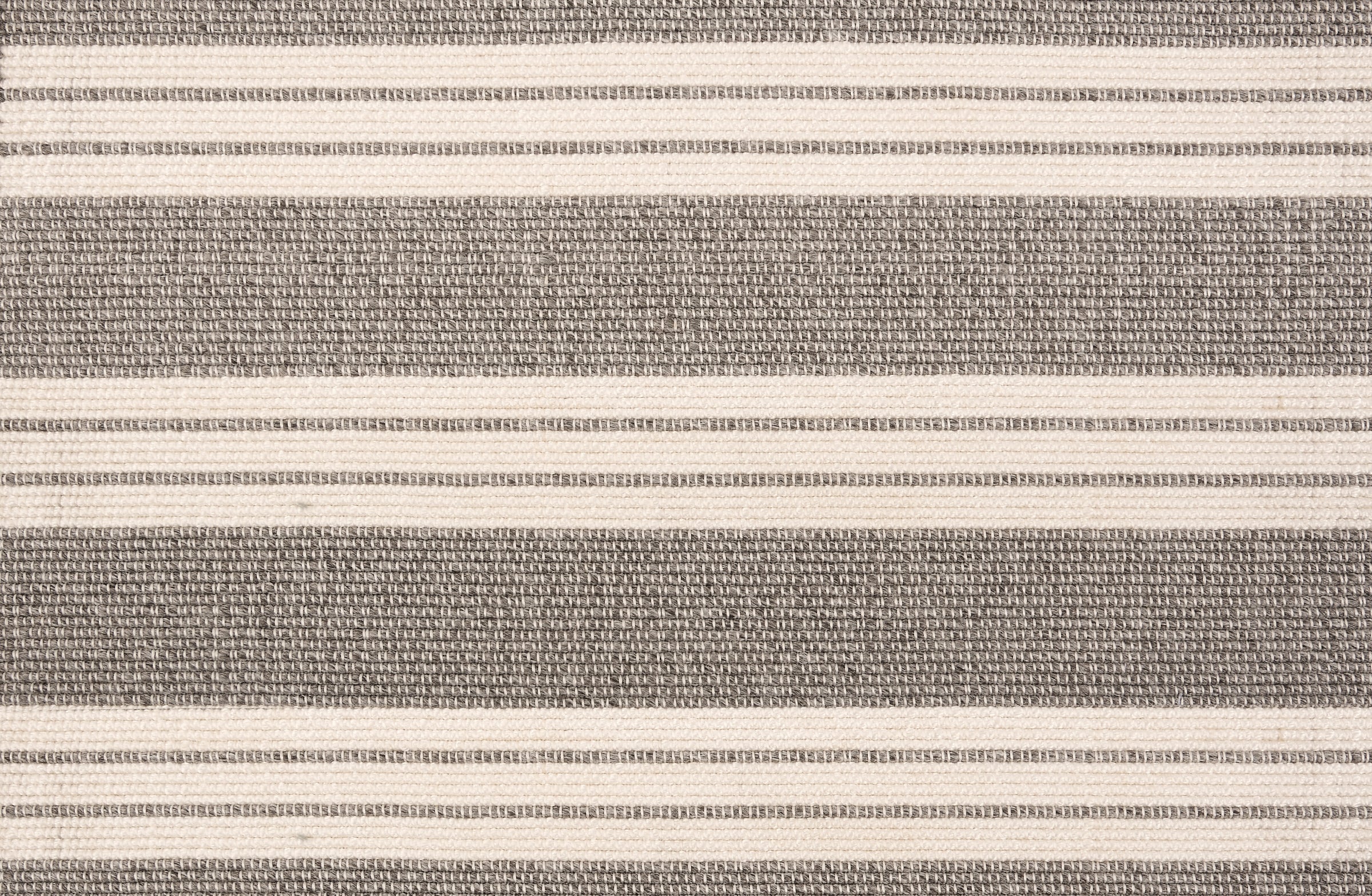 Broadloom carpet in a wide stripe in grey and cream with grey accent stripes. 