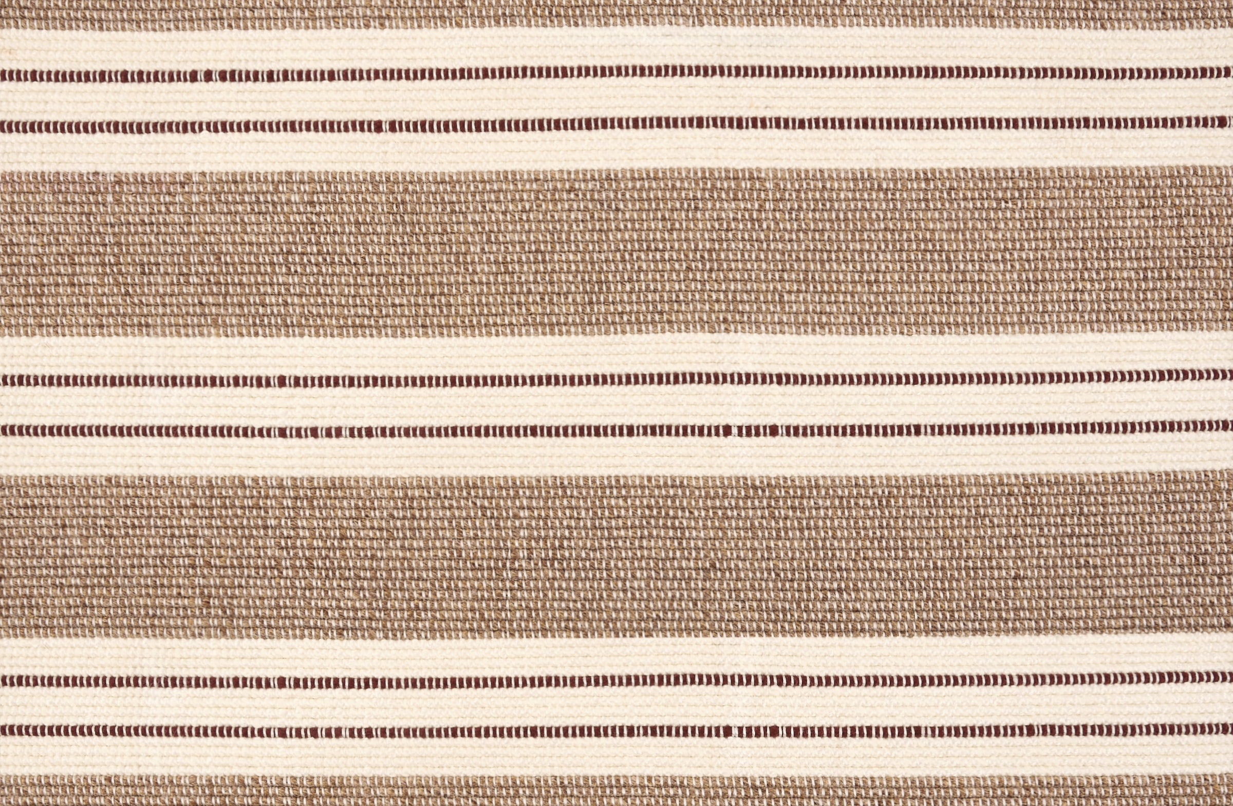 Broadloom carpet in a wide stripe in light brown and cream with dark brown accent stripes. 