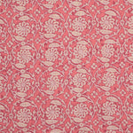 Patterned fabric with floral & vine design on a pink background