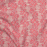 Patterned fabric with floral & vine design on a pink background