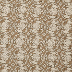 Patterned fabric with white floral design on a brown background