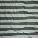 Close up of gently draped woven Indoor-Outdoor fabric with wide stripes in dark green and light blue.