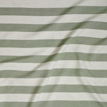 Close up of gently draped woven Indoor-Outdoor fabric with wide stripes in white and green.