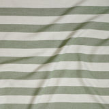Close up of gently draped woven Indoor-Outdoor fabric with wide stripes in white and green.