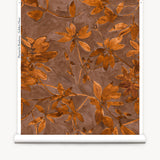 Roll of wallpaper with a floral pattern on a brown background
