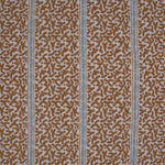 Printed fabric detail in a geometric rhythmic stripe in warm brown with a light blue accent