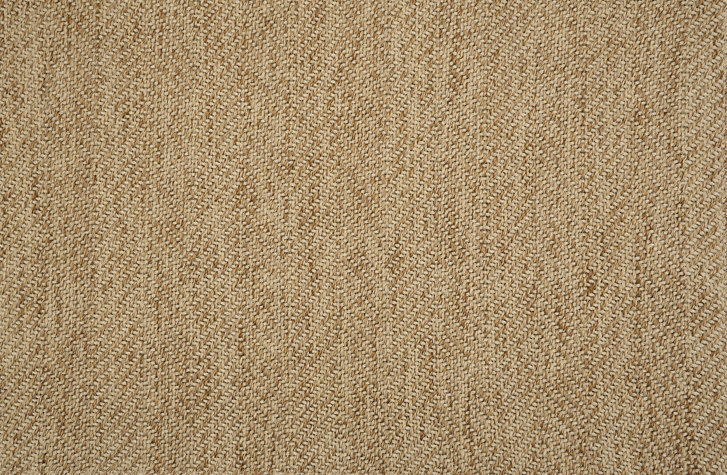 Textural performance broadloom carpet in herringbone design in tan.