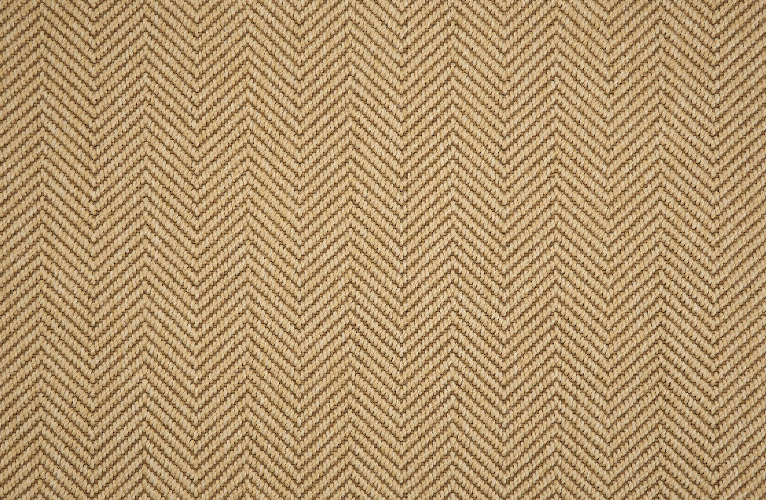 Textural performance broadloom carpet in herringbone design in tan.