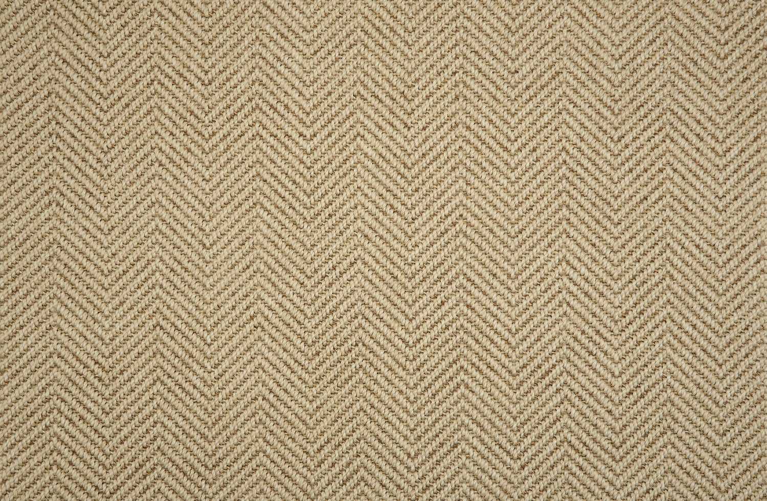 Textural performance broadloom carpet in herringbone design in beige.