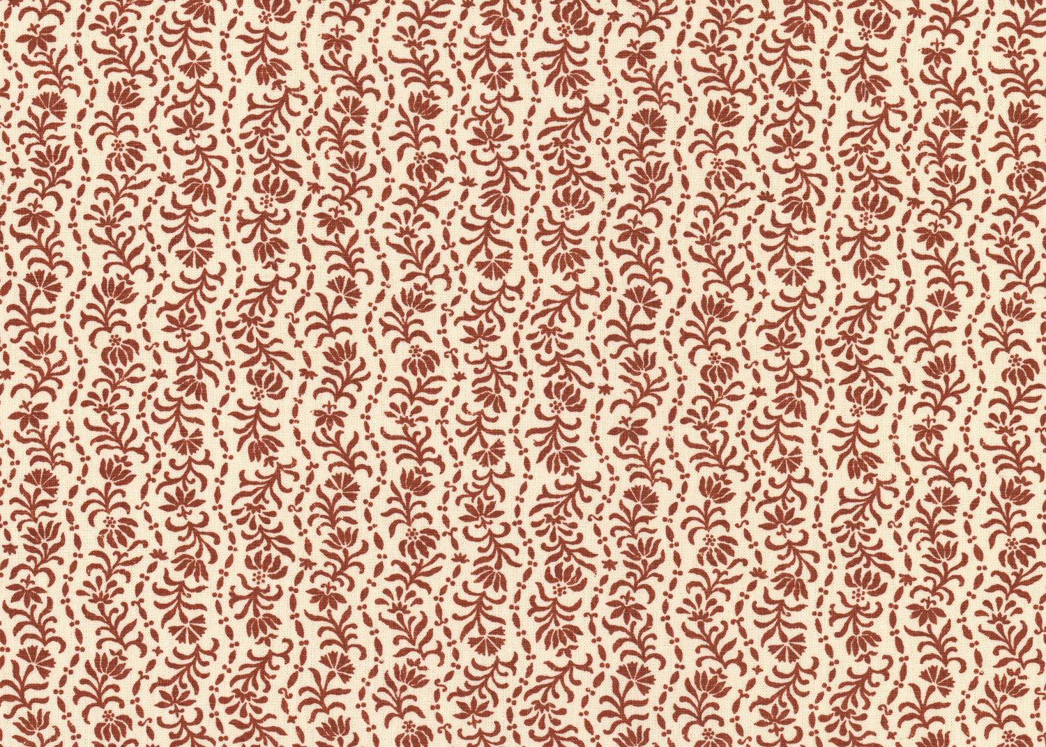 Printed linen in a wavy floral stripe design in red on cream.