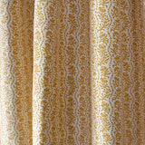 Drapped printed linen in a wavy floral stripe design in yellow on cream.