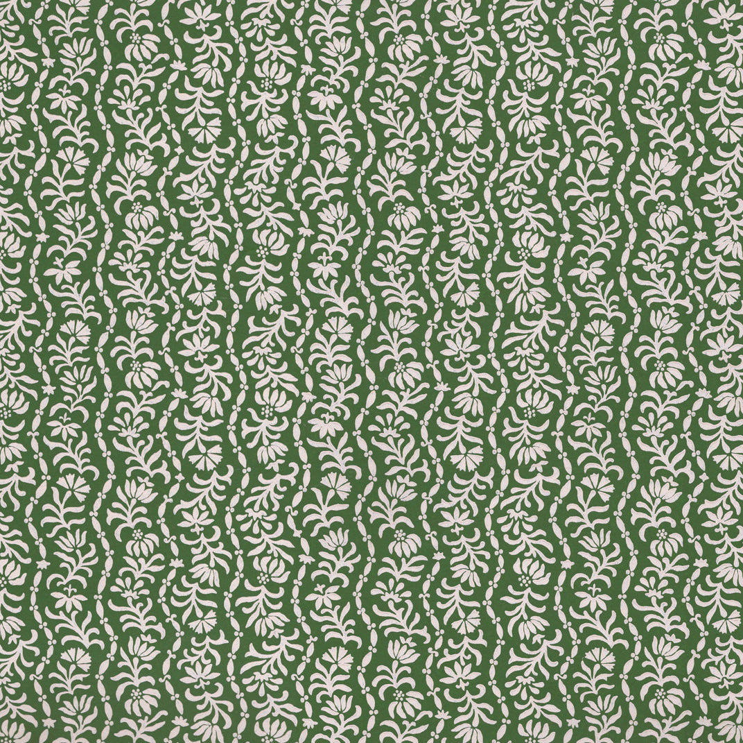 Printed linen in a wavy floral stripe design in green on white. 