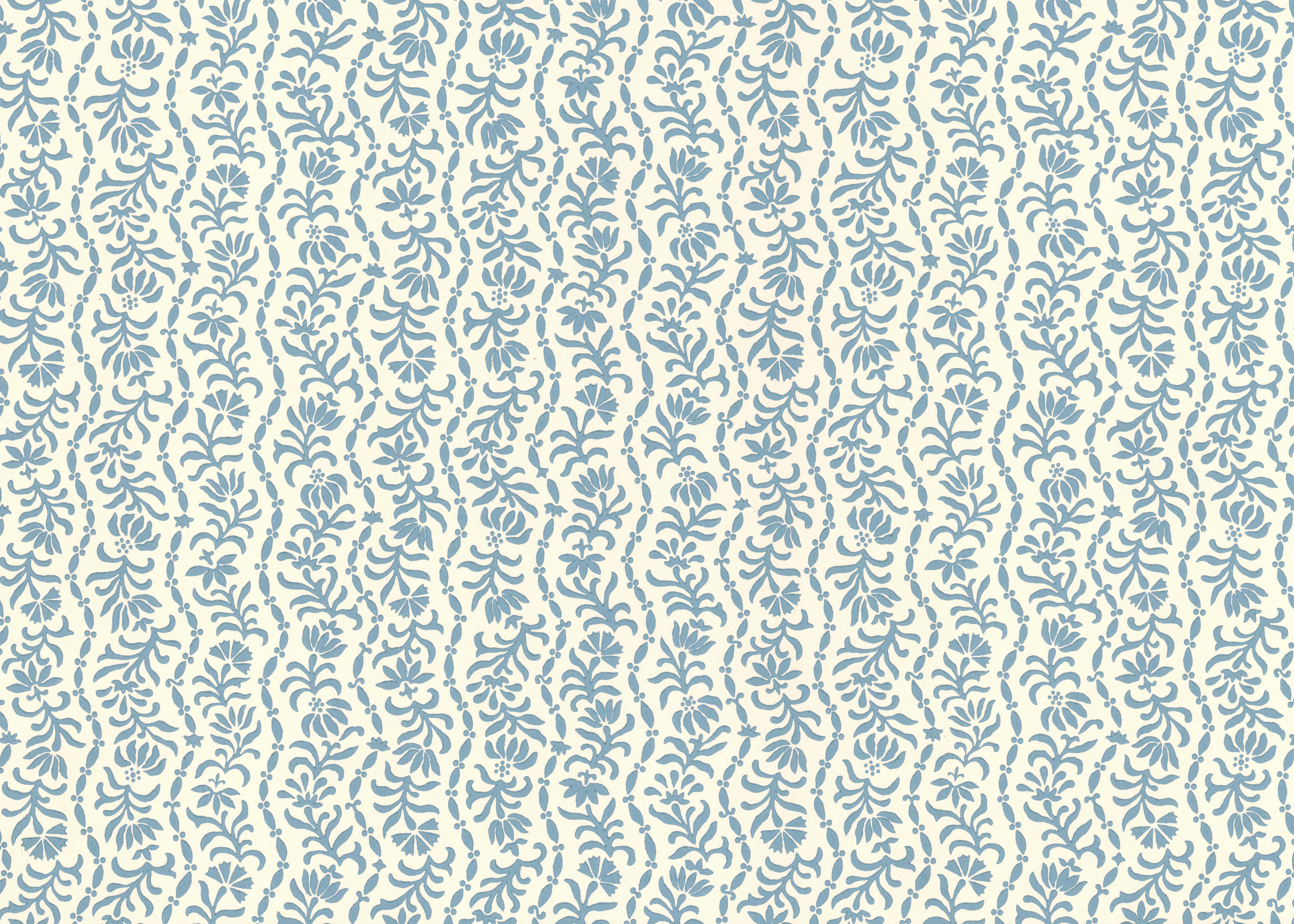 Wallpaper in a wavy floral stripe design in light blue on white. 