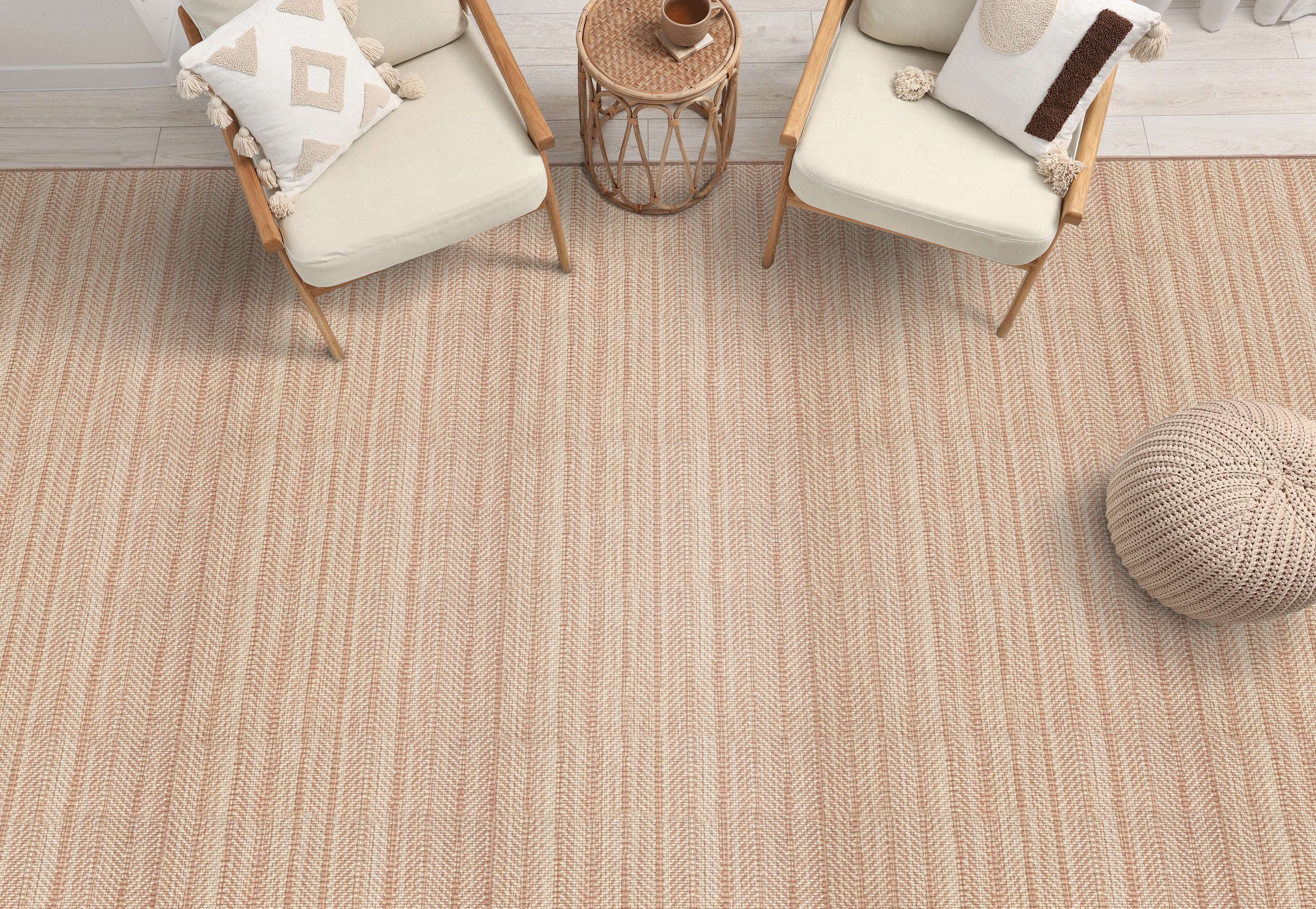 Textural herringbone area rug with wooden and white side chairs with rattan side stools.
