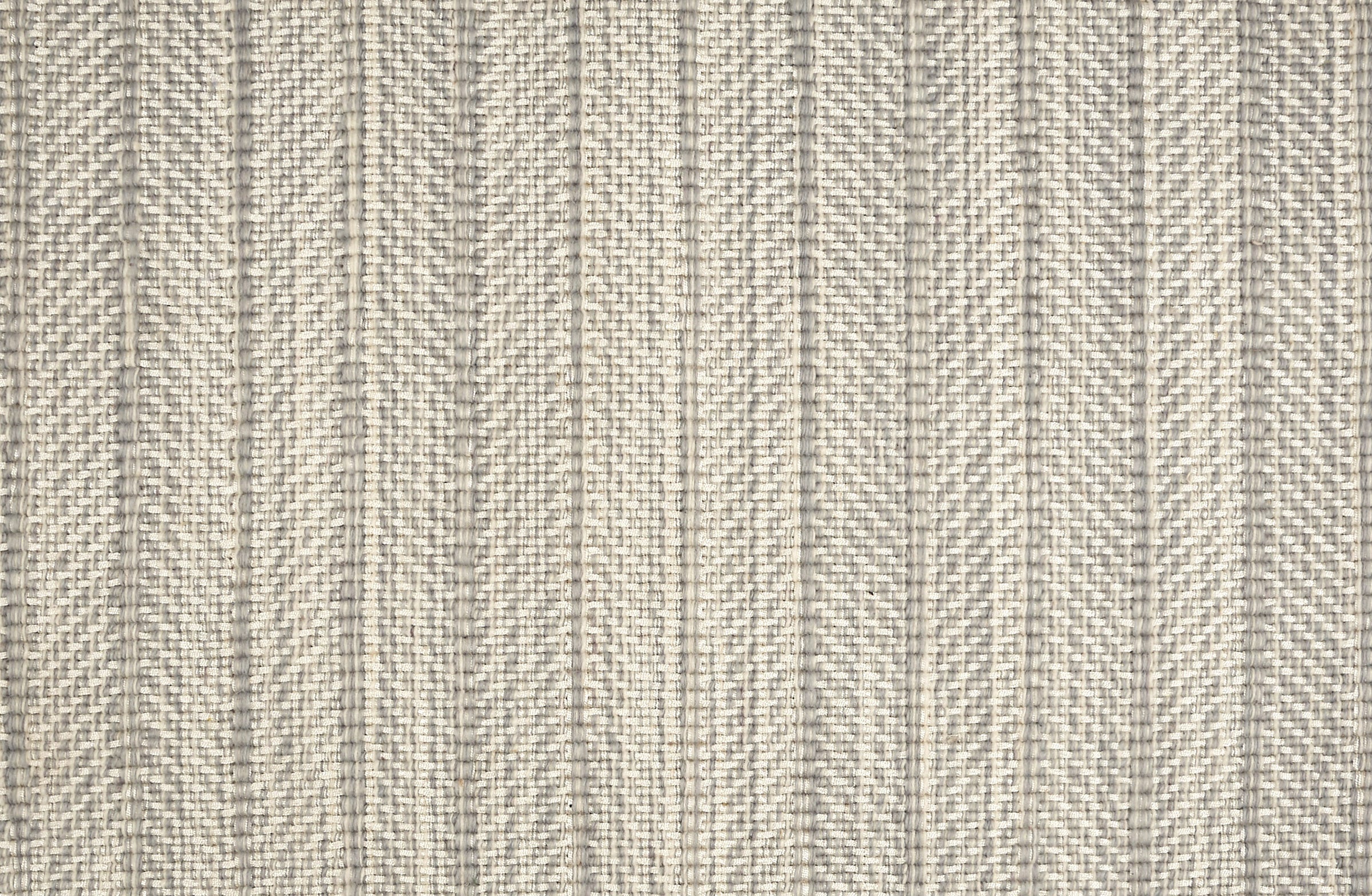 Broadloom carpet in a striated herringbone stripe in cream and grey.