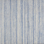 Broadloom carpet in a striated herringbone stripe in cream and bright blue.