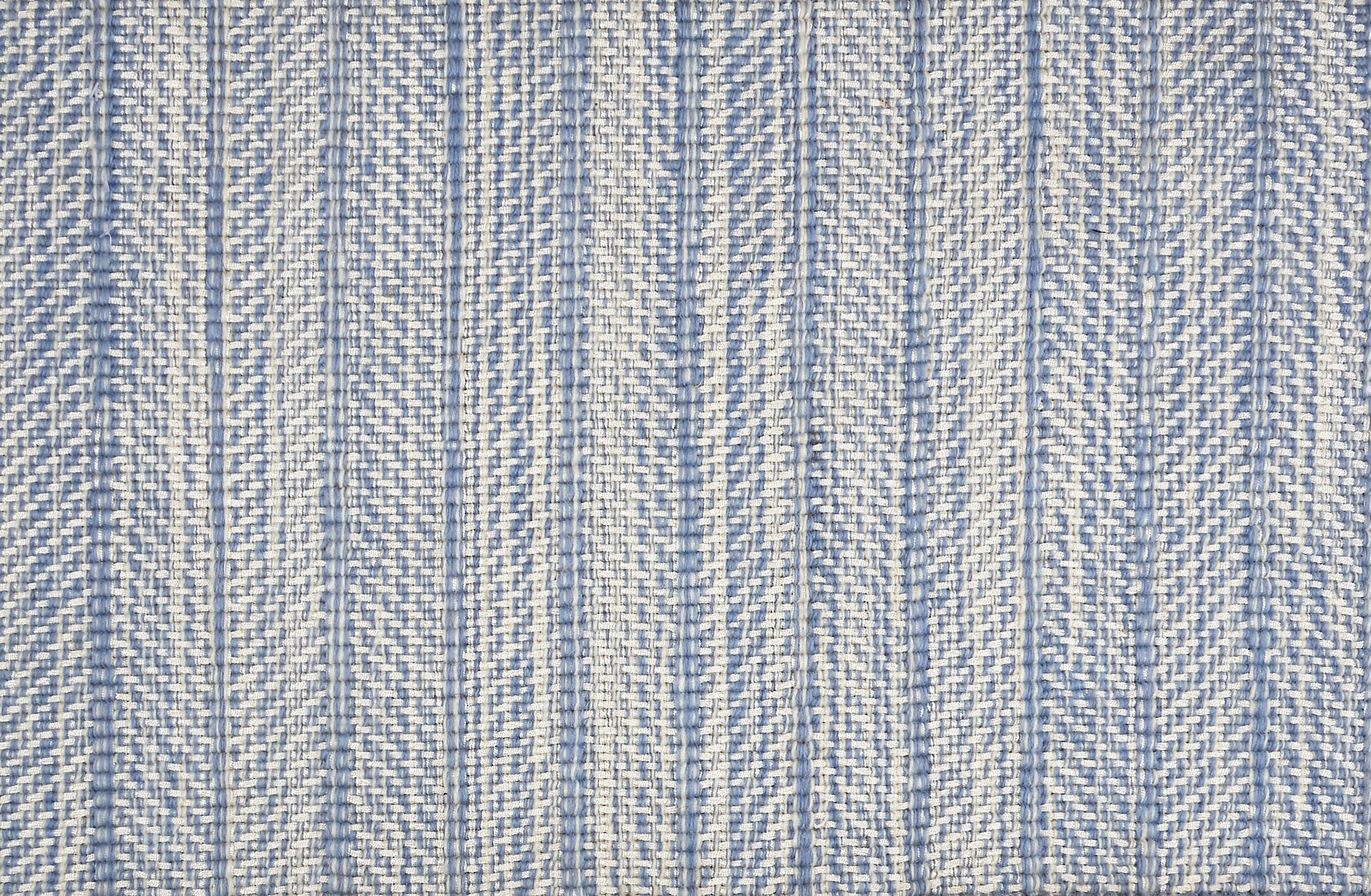 Broadloom carpet in a striated herringbone stripe in cream and bright blue.