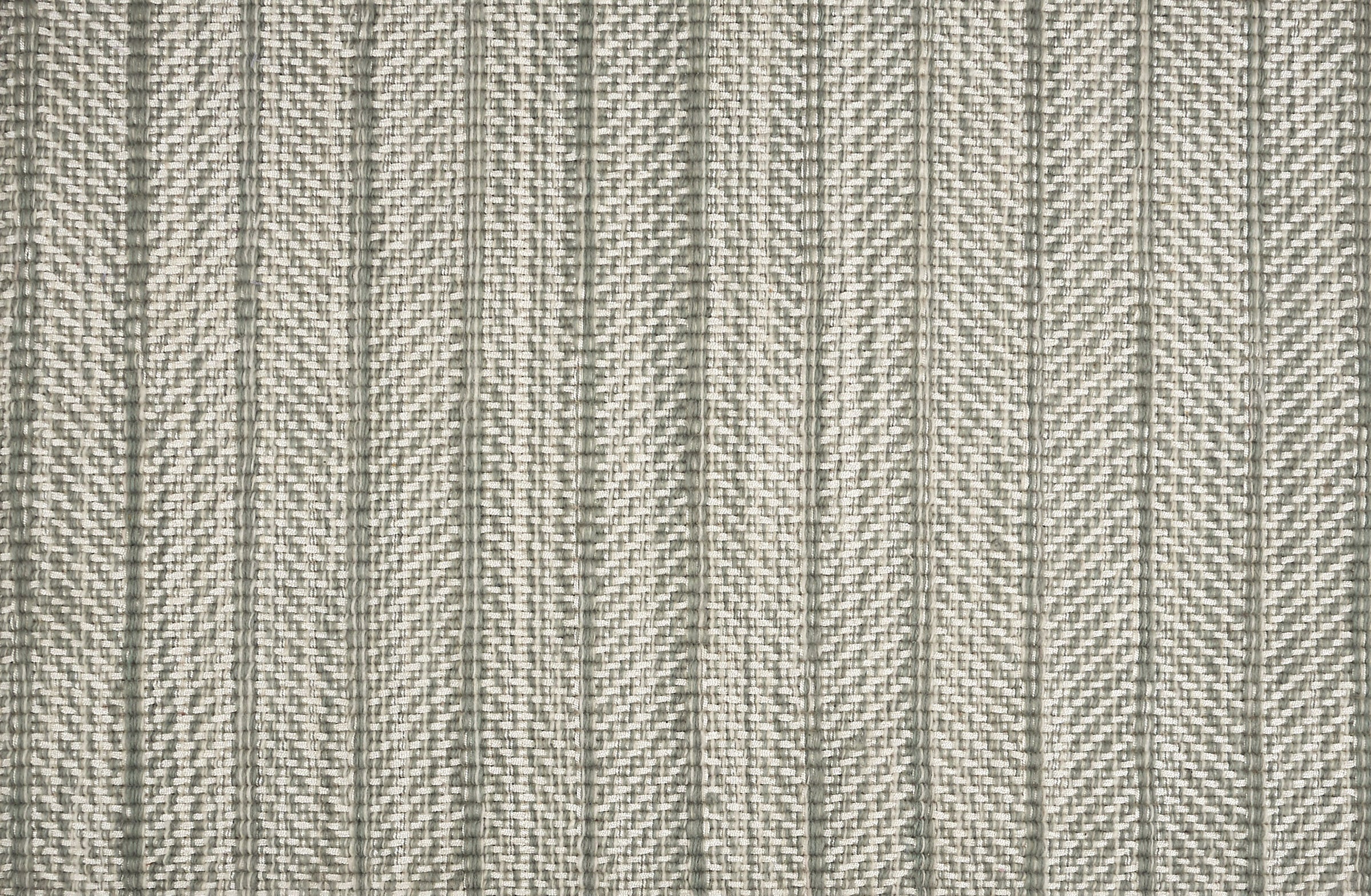Broadloom carpet in a striated herringbone stripe in cream and muted green. 