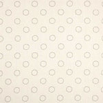 Detail of fabric in a playful dot print in charcoal on a cream field.