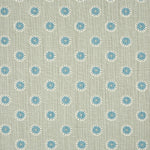 Detail of fabric in a playful dot print in blue and white on a gray field.