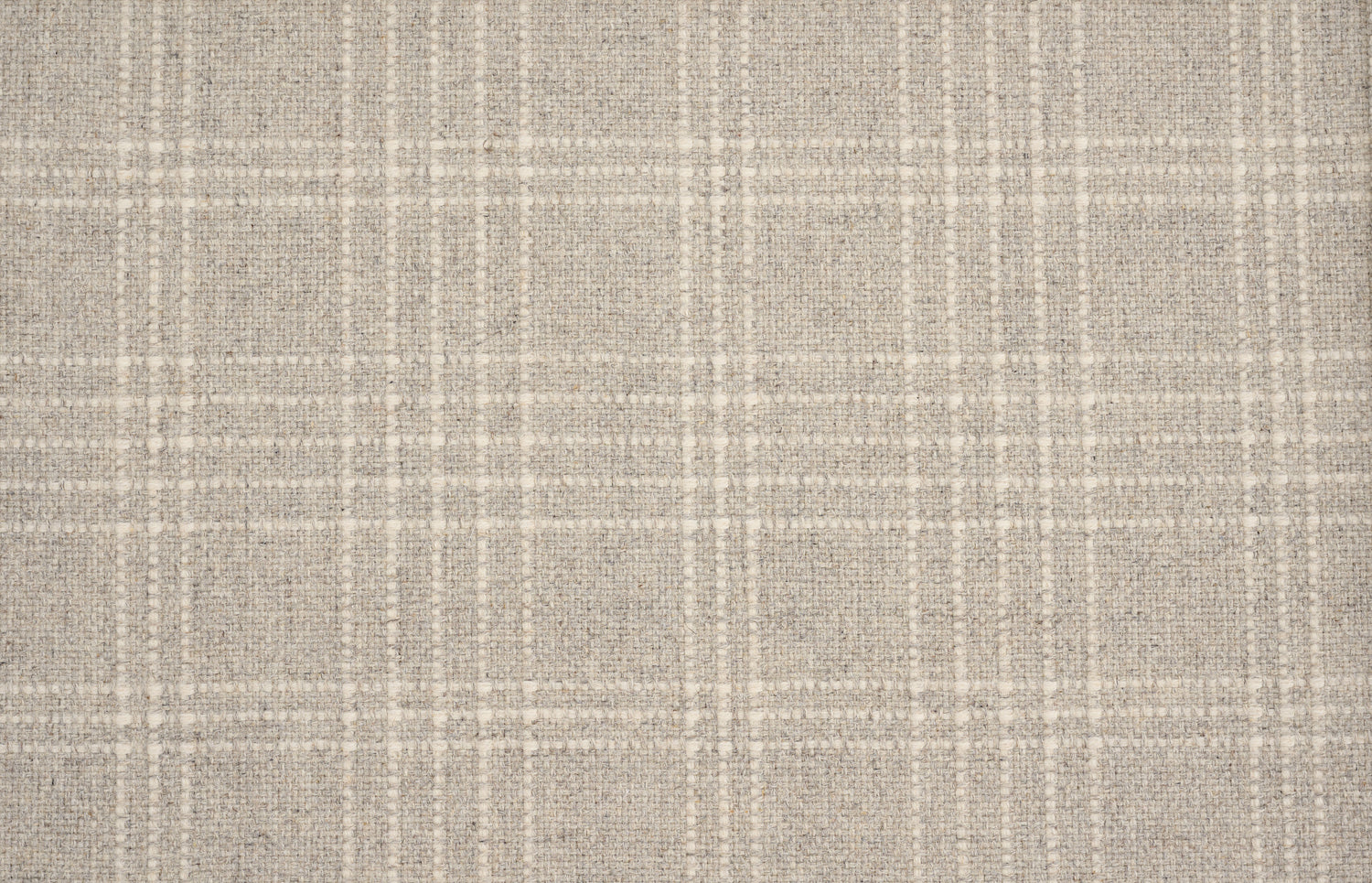 Broadloom carpet with windowpane plaid pattern in cream on a field of pale grey. 