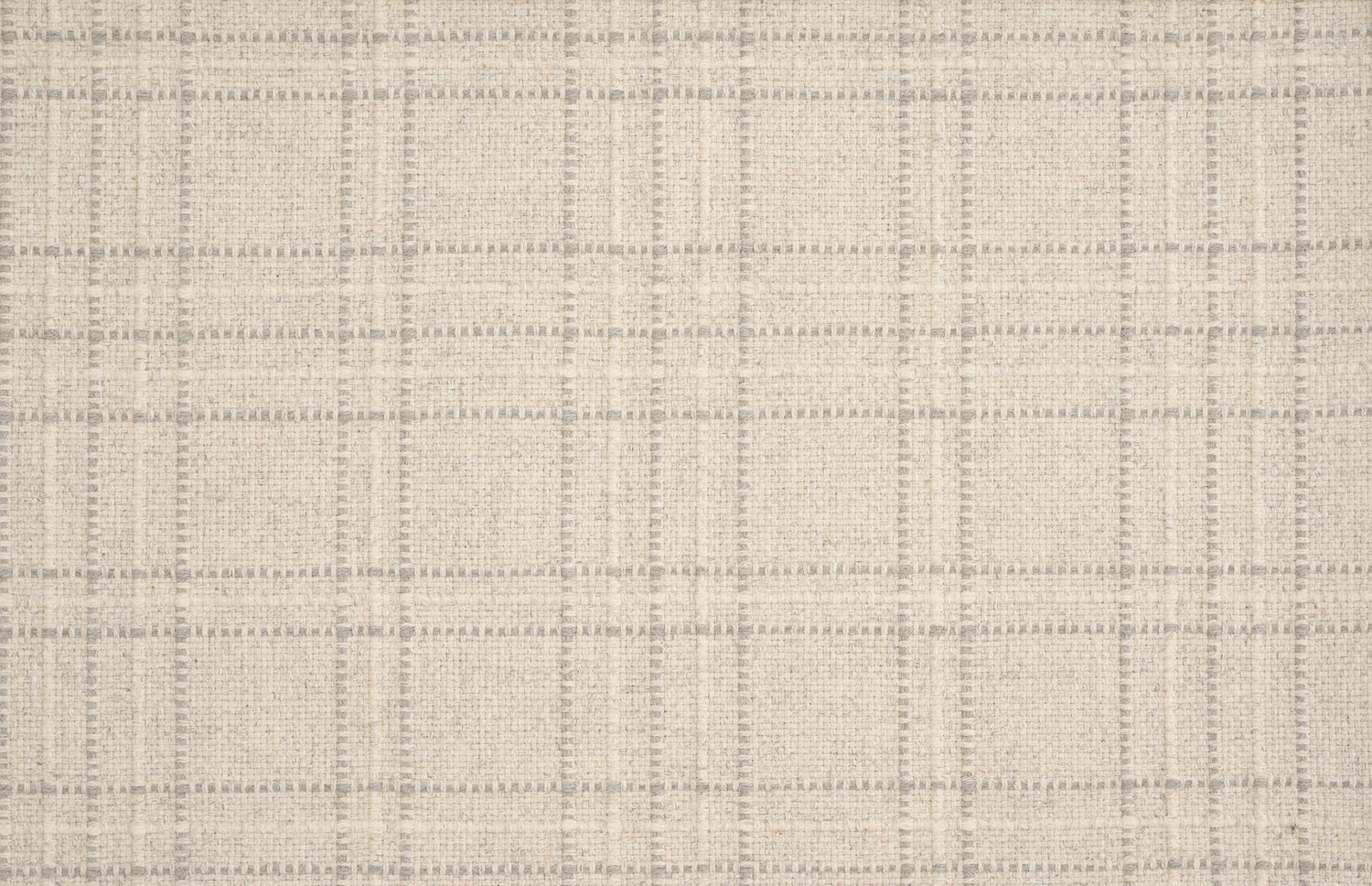 Broadloom carpet with windowpane plaid pattern in white and grey on a field of cream