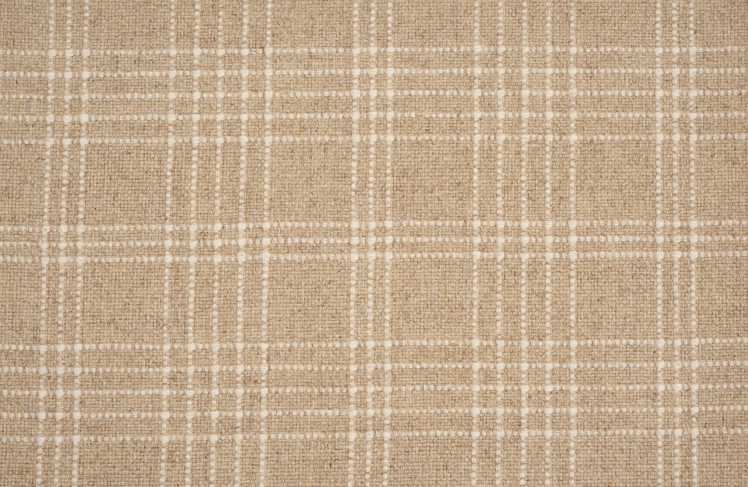Broadloom carpet with windowpane plaid pattern in white on a field of tan.