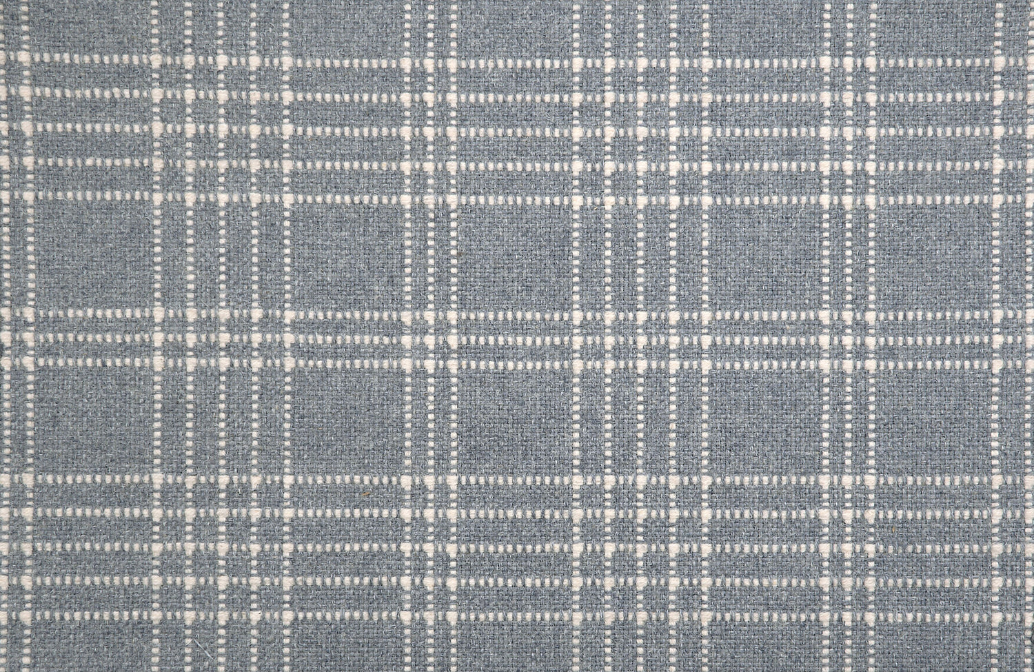 Broadloom carpet with windowpane plaid pattern in white  and grey on a field of cool blue.