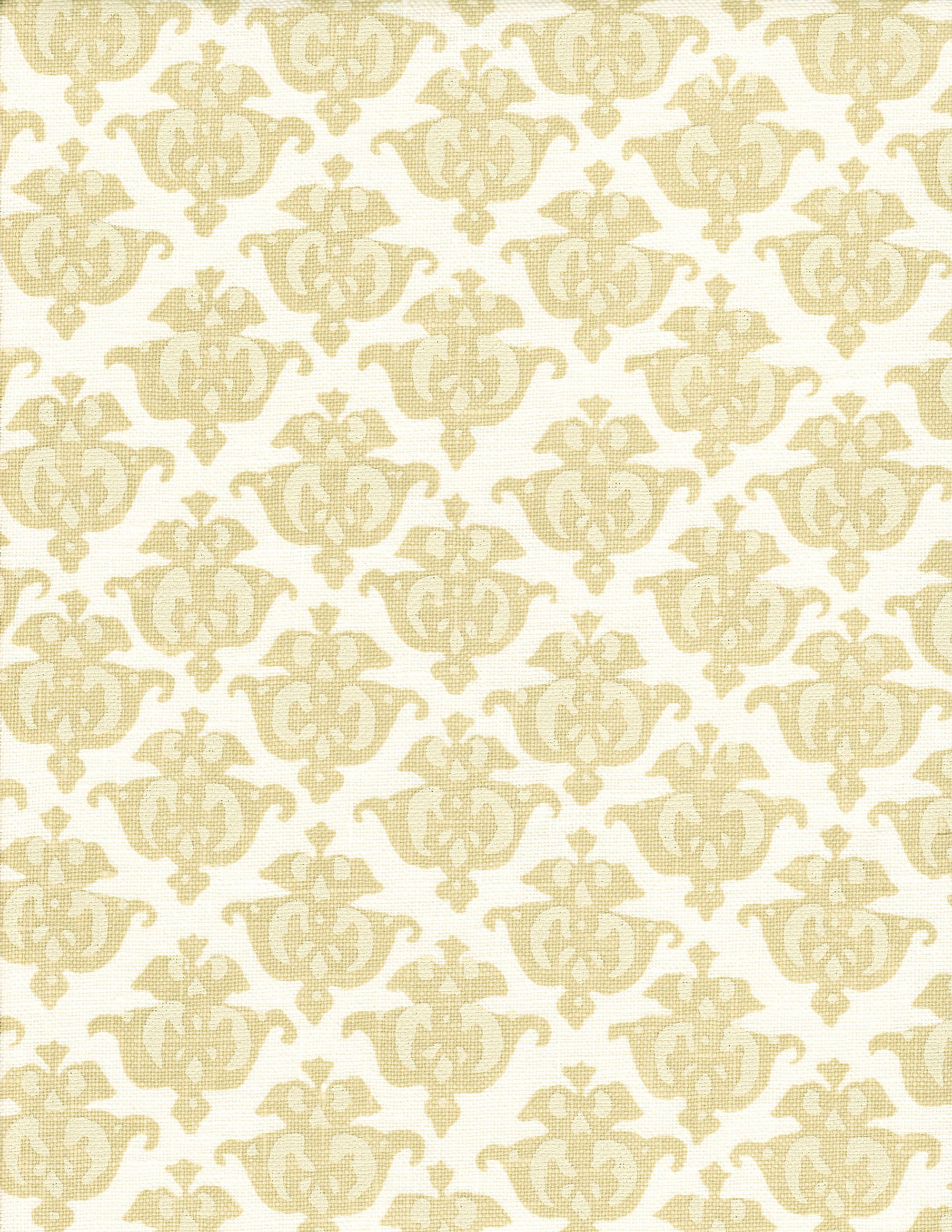 Detail of fabric in a repeating damask print in tan and cream on a white field.