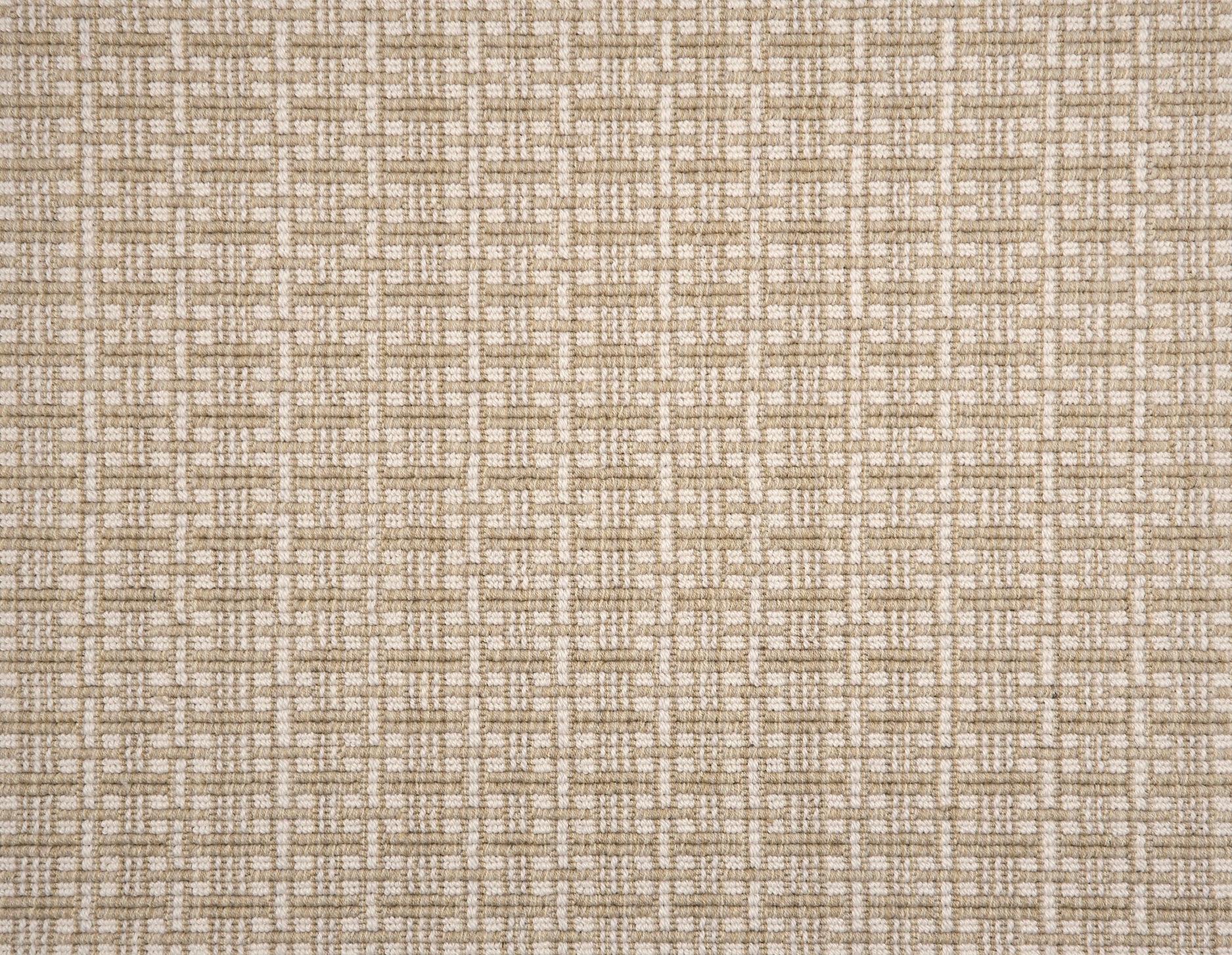 A close-up of broadloom carpet with a textured basketweave pattern in warm cream and taupe.