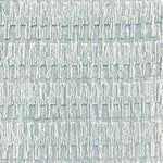 A close-up of a broadloom rug in a vertical ribbed pattern  in a neutral mix of off-white, and aqua blue.