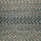 Handwoven rug detail in a contemporary zig zag design in slate and grey 