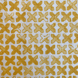 Pattern of yellow cross marks on a white background