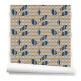 Wallpaper roll with a complex cornflower and dark blue striped floral motif overlayed a white and tan plaid pattern. 