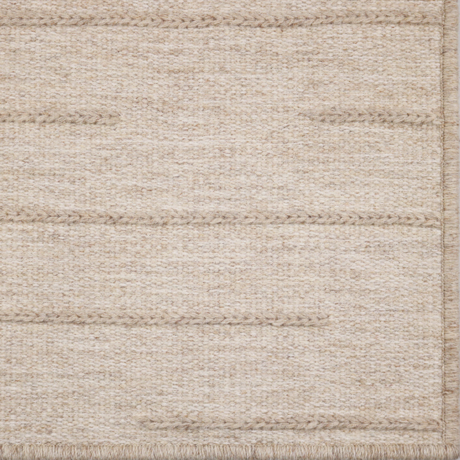 Beige woven texture rug with a subtle pattern